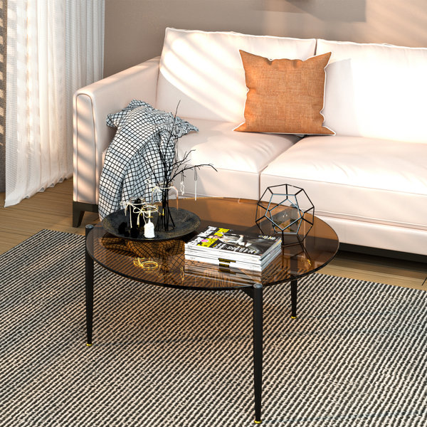 Round glass and black deals coffee table